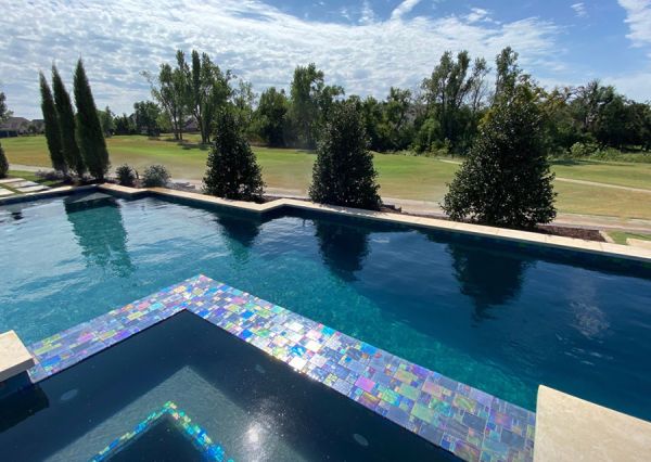 Artisan hand-cutting a mosaic tile